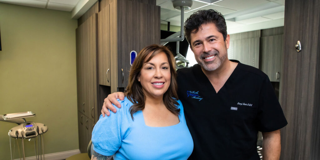 Patient and Doctor smiling after dental implant procedure